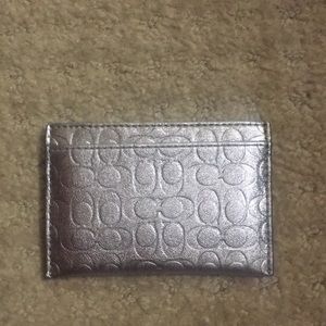 Metallic silver coach credit card holder